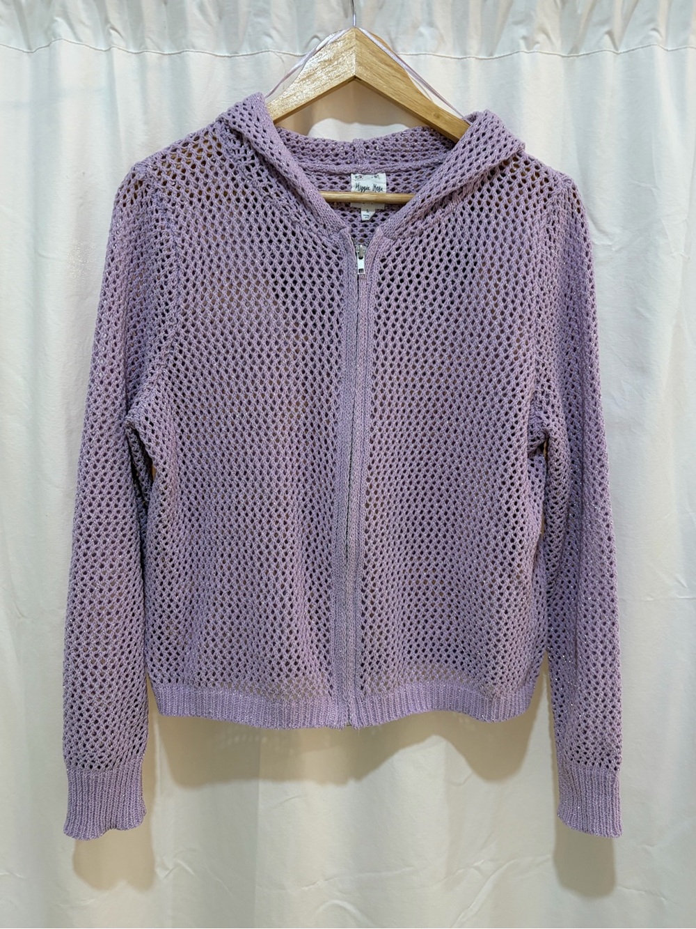 Woman’s lilac zip up sweater with hood